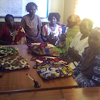 SAG Kit Distribution image showing Women from Jikaze Slums girls receiving 20 kits in Nyeri, Kenya on Sep 8, 2017