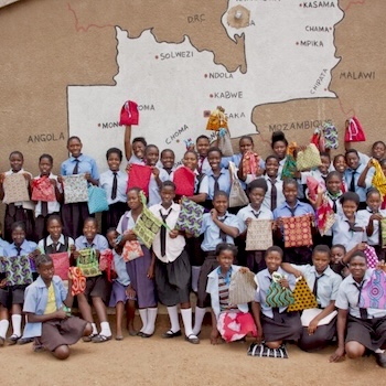 SAG Kit Distribution image showing Mbuluyenji School girls receiving 500 kits in Mambwe, Zambia on Sep 5, 2017