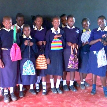 SAG Kit Distribution image showing Irembu School girls receiving 70 kits in Kaharo, Kenya on May 24, 2018