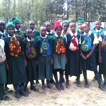 SAG Kit Distribution image showing Kihatha Secondary Schools girls receiving 30 kits in Kiganjo, Kenya on May 24, 2018