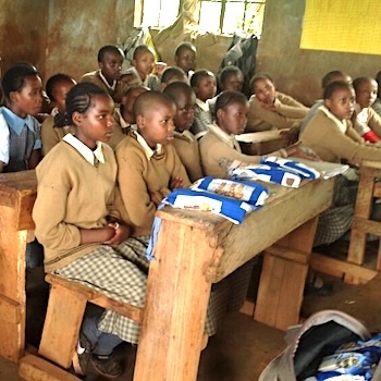 SAG Kit Distribution image showing Ngandu Primary School girls receiving 60 kits in Karatina, Kenya on Jan 10, 2019