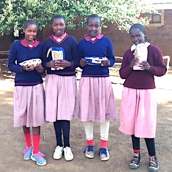 SAG Kit Distribution image showing Mugunda Primary School girls receiving 97 kits in Mugunda, Kenya on May 23, 2019