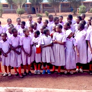 SAG Kit Distribution image showing Mugaka Primary School girls receiving 95 kits in Mugaka, Kenya on May 23, 2019