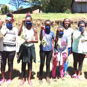 SAG Kit Distribution image showing Mwenji School girls receiving 213 kits in Mwenji, Kenya on Oct 3, 2020