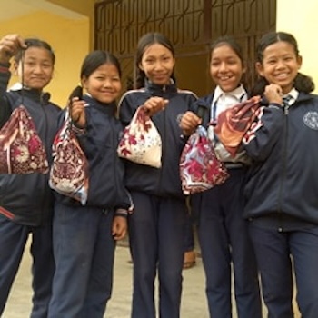 SAG Kit Distribution image showing Dang Valley College girls receiving 120 kits in Dang Valley, Nepal on Feb 28, 2020