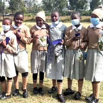 SAG Kit Distribution image showing Mary Mother Academy girls receiving 366 kits in Mweiga, Kenya on Feb 12, 2021