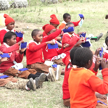SAG Kit Distribution image showing Amboni Primary School girls receiving 325 kits in Mweiga, Kenya on Feb 25, 2021