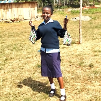 SAG Kit Distribution image showing Maganjo Secondary School girls receiving 180 kits in Maganjo, Kenya on Aug 5, 2021
