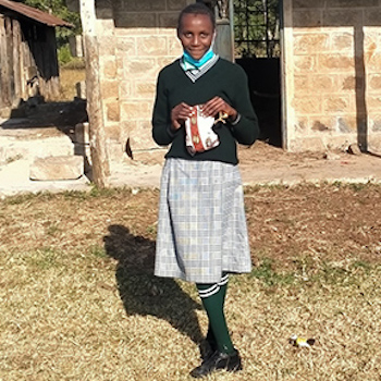 SAG Kit Distribution image showing Chieni Primary School girls receiving 243 kits in Maganjo, Kenya on Aug 5, 2021