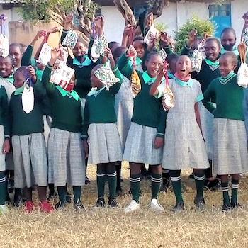 SAG Kit Distribution image showing Kiandai Secondary School girls receiving 302 kits in Kiandai, Kenya on Aug 6, 2021
