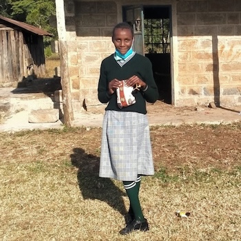 SAG Kit Distribution image showing Kiandai Secondary School girls receiving 302 kits in Kiandai, Kenya on Aug 6, 2021