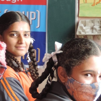SAG Kit Distribution image showing Sataya Sai School girls receiving 72 kits in Dharamshala, India on Feb 23, 2022