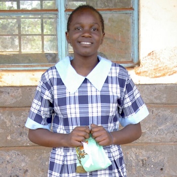 SAG Kit Distribution image showing Kiyo Primary School girls receiving 93 kits in Othaya, Kenya on May 25, 2022