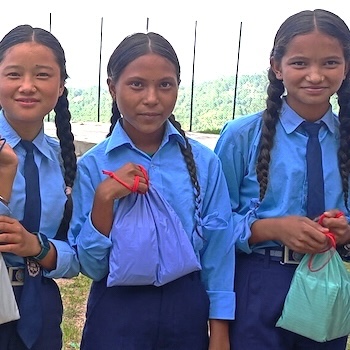 SAG Kit Distribution image showing Sudha Secondary School girls receiving 400 kits in Banlachuli, Nepal on Aug 9, 2022