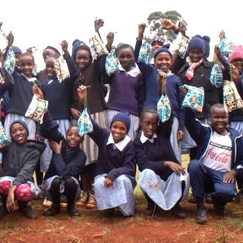 SAG Kit Distribution image showing Kigwandi Primary School girls receiving 355 kits in Kigwandi, Kenya on Aug 26, 2022