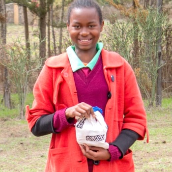 SAG Kit Distribution image showing Ndiriti Primary School girls receiving 355 kits in Naromoru, Kenya on Nov 18, 2022