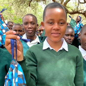 SAG Kit Distribution image showing Terrat Secondary School girls receiving 105 kits in Terrat, Tanzania on May 5, 2023