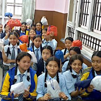 SAG Kit Distribution image showing Deep Jyoti School girls receiving 32 kits in Buspark Kathmandu, Nepal on May 23, 2023