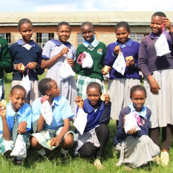 SAG Kit Distribution image showing Ndemu Primary School girls receiving 144 kits in Ndemu, Kenya on Jun 16, 2023