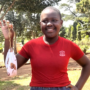 SAG Kit Distribution image showing Nsawo Primary School girls receiving 53 kits in Nsawo, Uganda on Aug 22, 2023