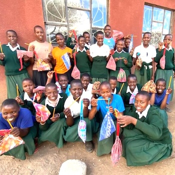 SAG Kit Distribution image showing Terrat Secondary School girls receiving 154 kits in Terrat, Tanzania on Sep 29, 2023