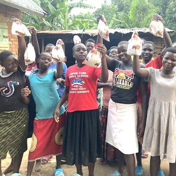 SAG Kit Distribution image showing Jahleel Orphanage girls receiving 101 kits in Bugobi, Uganda on Oct 2, 2023