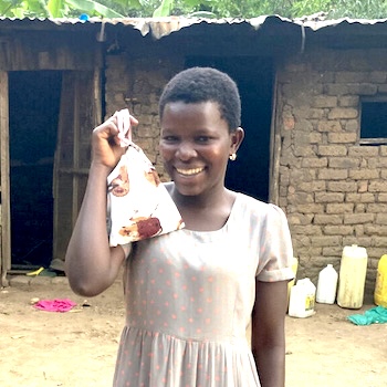 SAG Kit Distribution image showing Jahleel Orphanage girls receiving 101 kits in Bugobi, Uganda on Oct 2, 2023