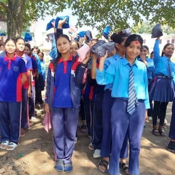 SAG Kit Distribution image showing Shree Secondary School girls receiving 100 kits in Saudiyar, Nepal on Oct 13, 2023