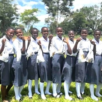 SAG Kit Distribution image showing Legacy Christian Secondary School girls receiving 67 kits in Kubamitwe, Uganda on Oct 19, 2023