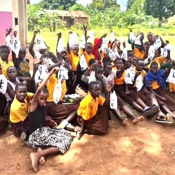 SAG Kit Distribution image showing Kyetume Church of Uganda Primary School girls receiving 55 kits in Kyetume, Uganda on Oct 19, 2023