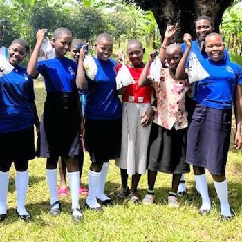 SAG Kit Distribution image showing Alliance Secondary School girls receiving 46 kits in Mitiyana, Uganda on Nov 4, 2023