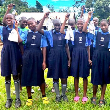 SAG Kit Distribution image showing Zion Primary School girls receiving 44 kits in Kabule, Uganda on Nov 4, 2023