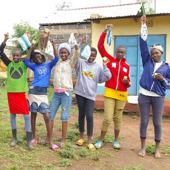 SAG Kit Distribution image showing St. Anthony School + Gitegi Primary girls receiving 285 kits in Gitegi, Kenya on Nov 8, 2023