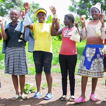 SAG Kit Distribution image showing Mumbuini Village girls receiving 257 kits in Mwea, Kenya on Nov 20, 2023