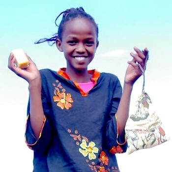SAG Kit Distribution image showing Gold Primary School girls receiving 163 kits in Mwea, Kenya on Nov 22, 2023