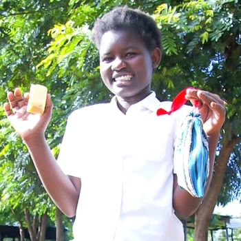 SAG Kit Distribution image showing Ikurungu Secondary School girls receiving 91 kits in Mwea, Kenya on Nov 22, 2023