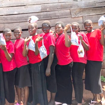 SAG Kit Distribution image showing St. Mark High School girls receiving 82 kits in Kayunga, Uganda on Nov 24, 2023