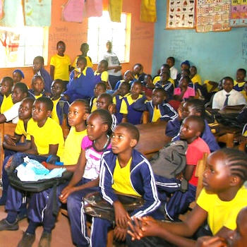 SAG Kit Distribution image showing Mumbuini Primary School girls receiving 155 kits in Mumbuini, Kenya on Jan 23, 2024