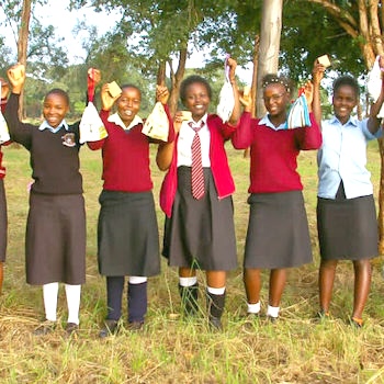 SAG Kit Distribution image showing Mumbuini Secondary School girls receiving 125 kits in Mumbuini, Kenya on Jan 23, 2024