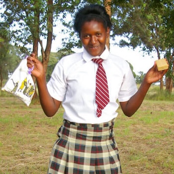 SAG Kit Distribution image showing Mumbuini Secondary School girls receiving 125 kits in Mumbuini, Kenya on Jan 23, 2024