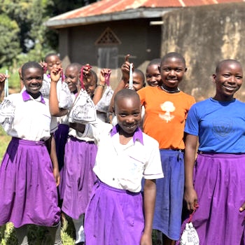 SAG Kit Distribution image showing Kawe Primary School girls receiving 161 kits in Kikyusa, Uganda on Feb 22, 2024