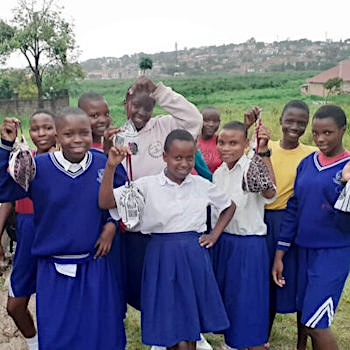 SAG Kit Distribution image showing Bukasa Primary School girls receiving 150 kits in Makindye, Uganda on Apr 4, 2024
