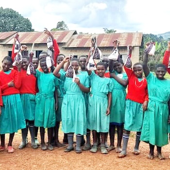SAG Kit Distribution image showing Rubiira Primary School girls receiving 42 kits in Bubare, Uganda on Apr 5, 2024