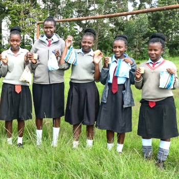 SAG Kit Distribution image showing Kiandere Secondary School girls receiving 118 kits in Kiandere, Kenya on May 17, 2024