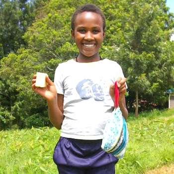 SAG Kit Distribution image showing Kamuyu Primary School girls receiving 138 kits in Kamakwa, Kenya on May 24, 2024