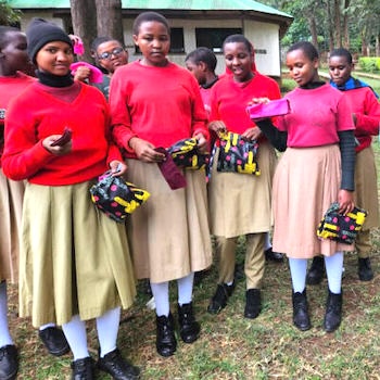 SAG Kit Distribution image showing Ailanga Secondary School girls receiving 72 kits in Manyara, Tanzania on May 28, 2024