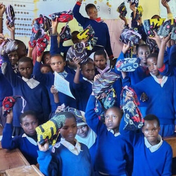 SAG Kit Distribution image showing Qedangonyi Primary School girls receiving 26 kits in Manyara, Tanzania on May 29, 2024