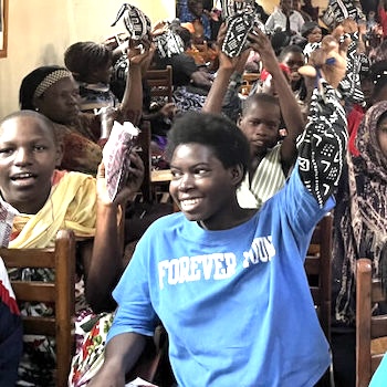SAG Kit Distribution image showing Jimmy Sekasi Institute girls receiving 200 kits in Kabalagala, Uganda on Jun 9, 2024
