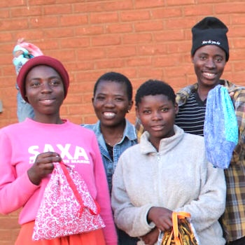 SAG Kit Distribution image showing Dzaleka Refugee Camp girls receiving 60 kits in Dowa, Malawi on Jul 19, 2024