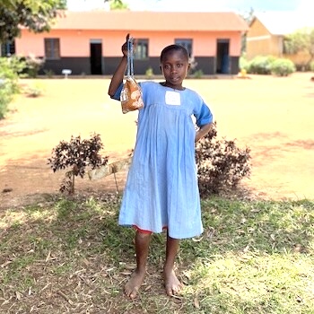 SAG Kit Distribution image showing Butabula Primary School girls receiving 107 kits in Kabukye, Uganda on Aug 9, 2024
